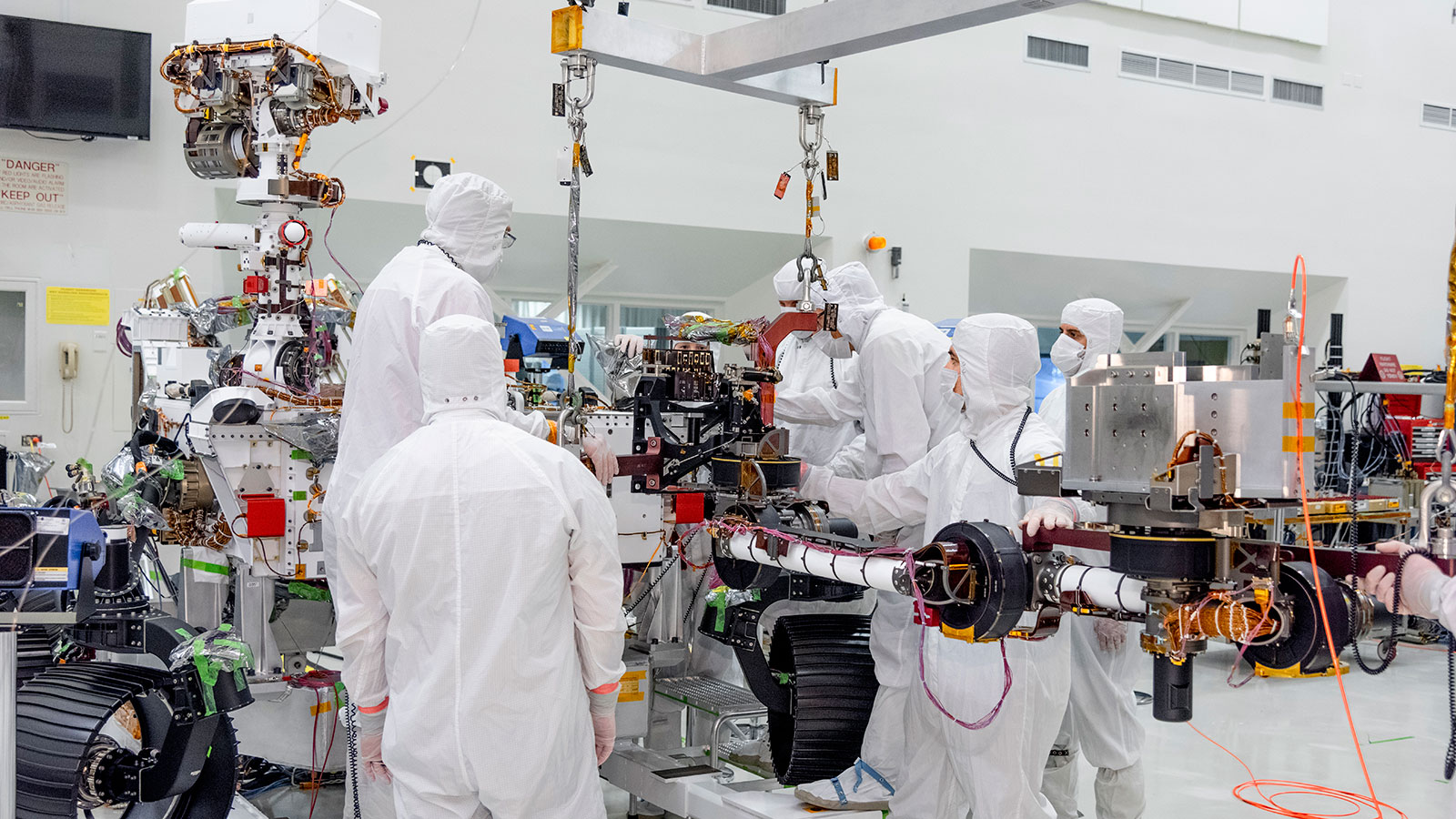 On June 21, 2019, engineers at NASA's Jet Propulsion Laboratory install the main robotic arm on the Mars 2020 rover