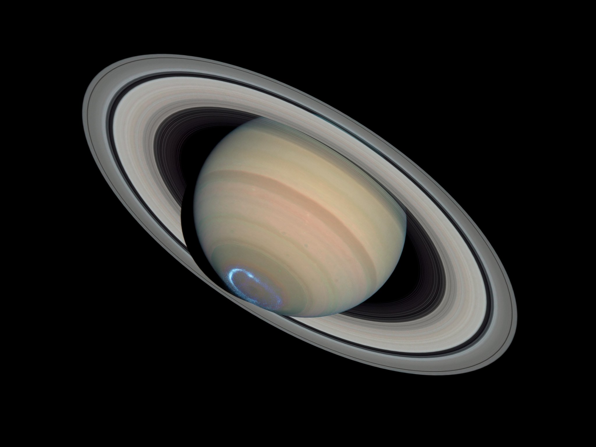 Saturn experiences auroras, also known as northern and southern lights, just like Earth.