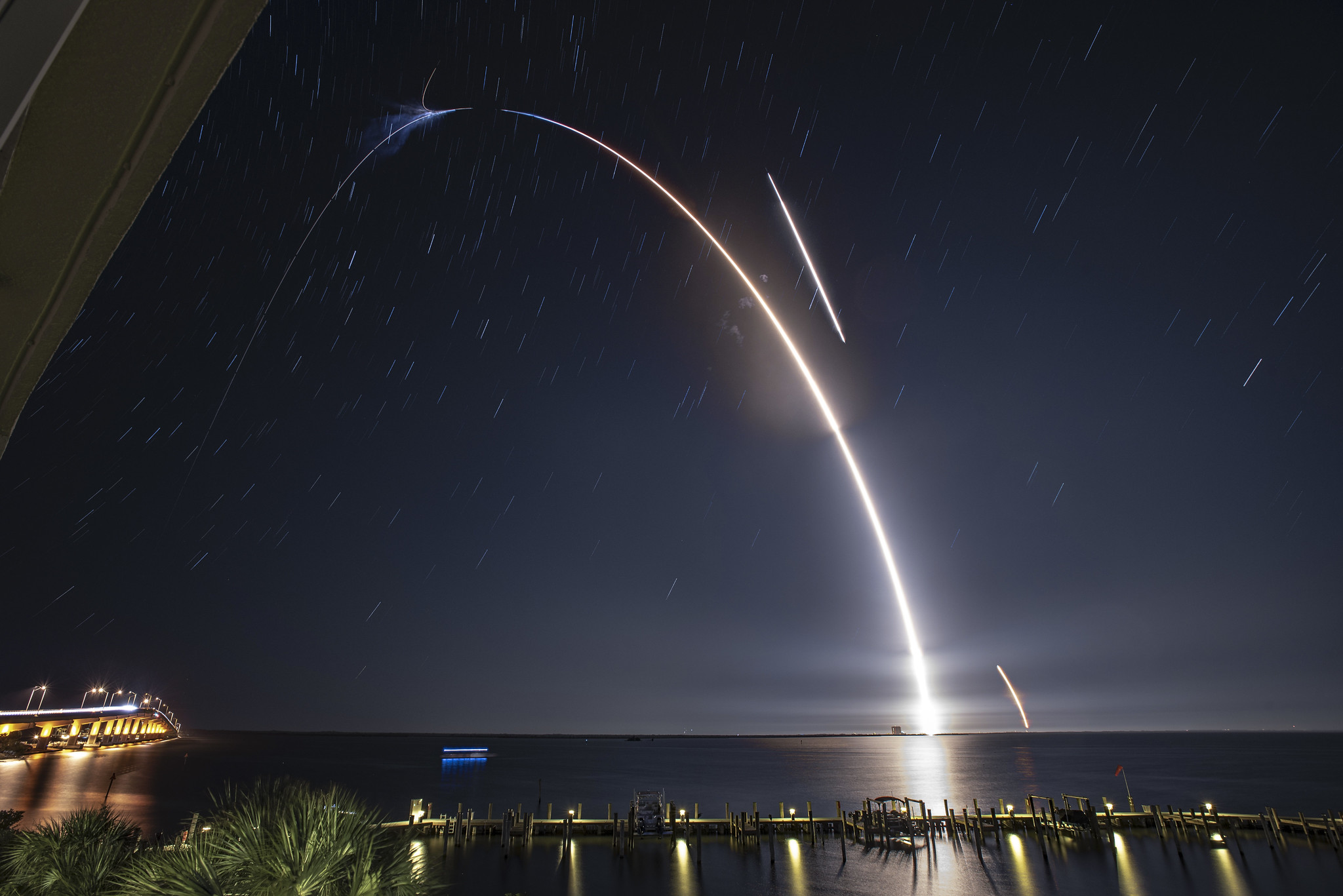 SpaceX resupply mission launching in the night sky 