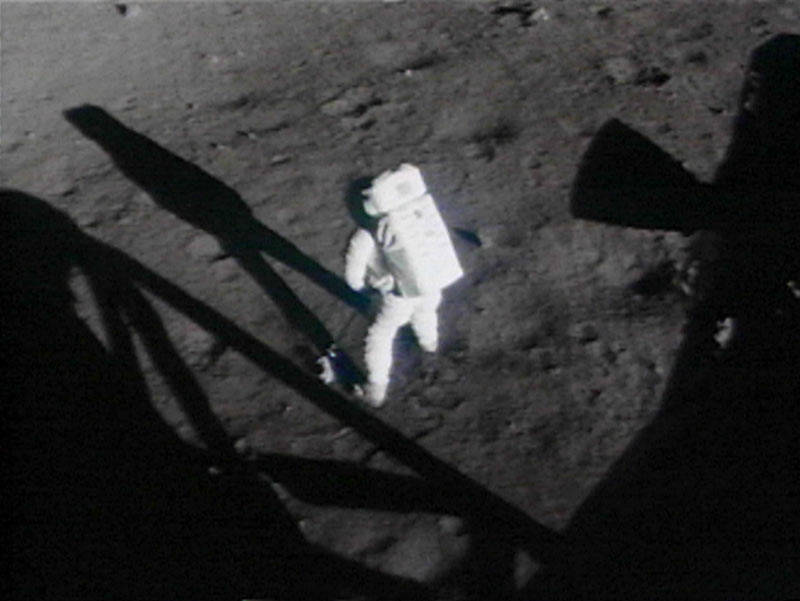 apollo_11_armstrong_collecting_contingency_sample_from_16_mm