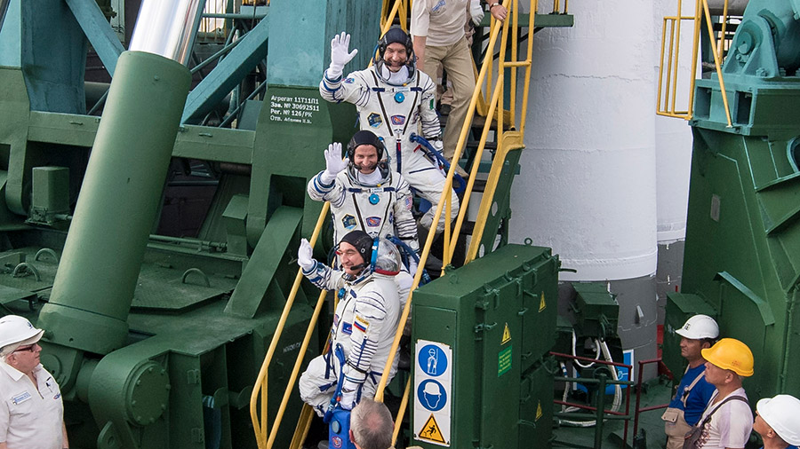 The Expedition 60 crew members boarding their Soyuz MS-13 spacecraft