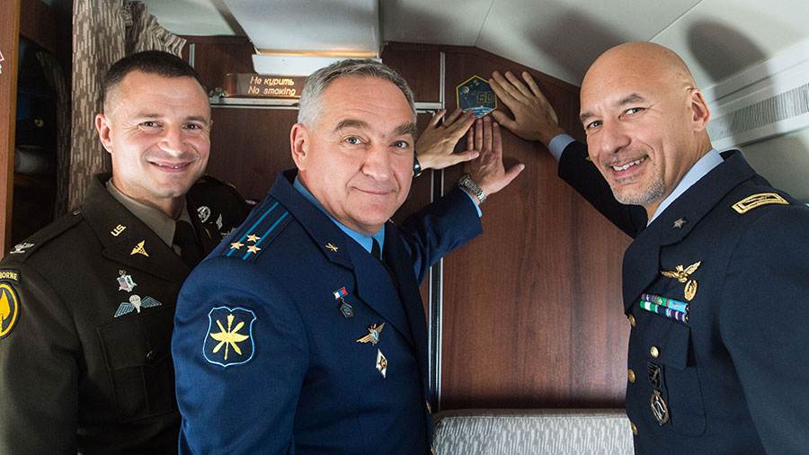 Expedition 60 crewmembers aboard a Gagarin Cosmonaut Training Center aircraft