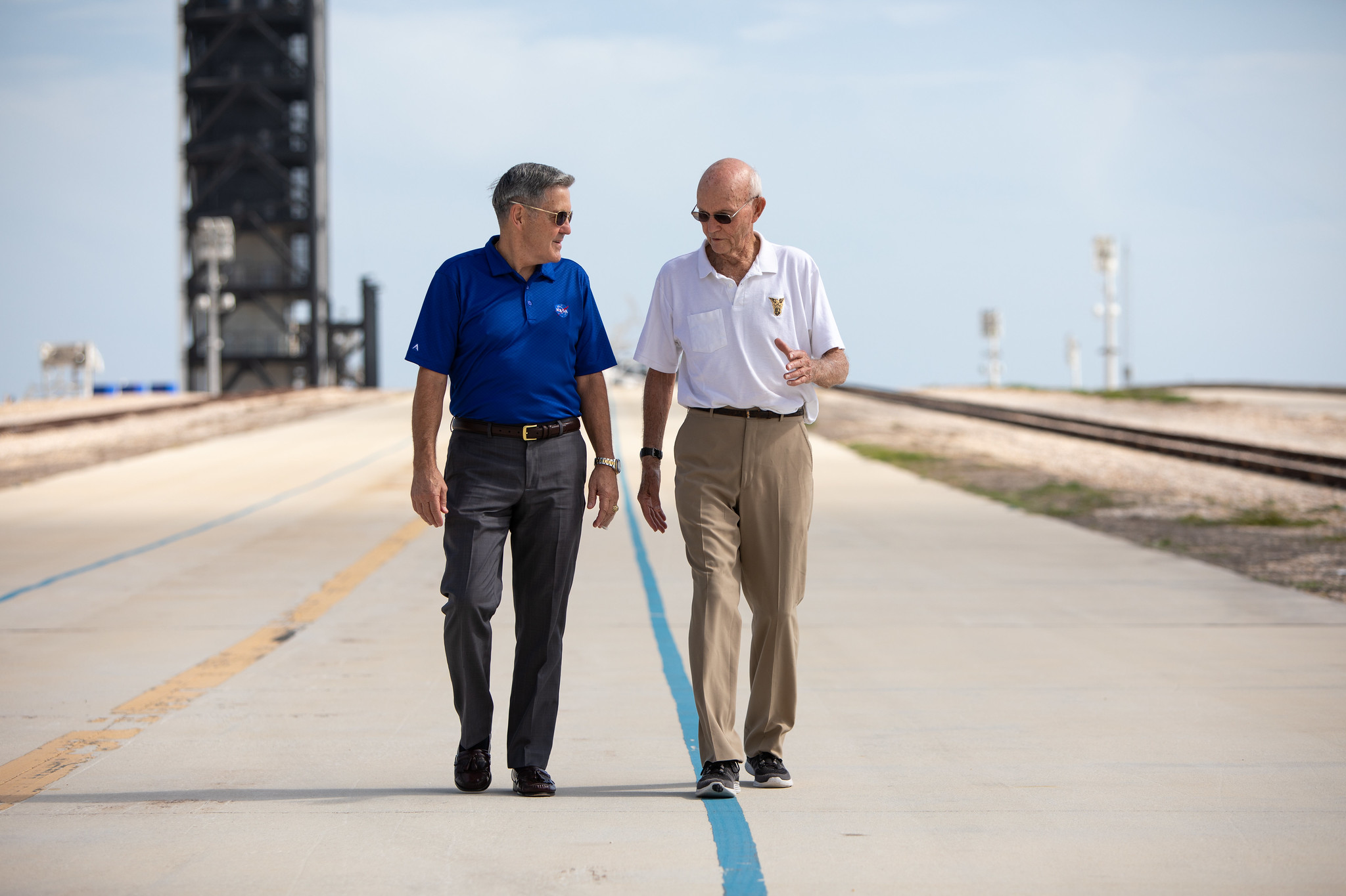 On July 16, 2019, astronaut Michael Collins, right, speaks to Kennedy Space Center Director Bob Cabana at Launch Complex 39A.