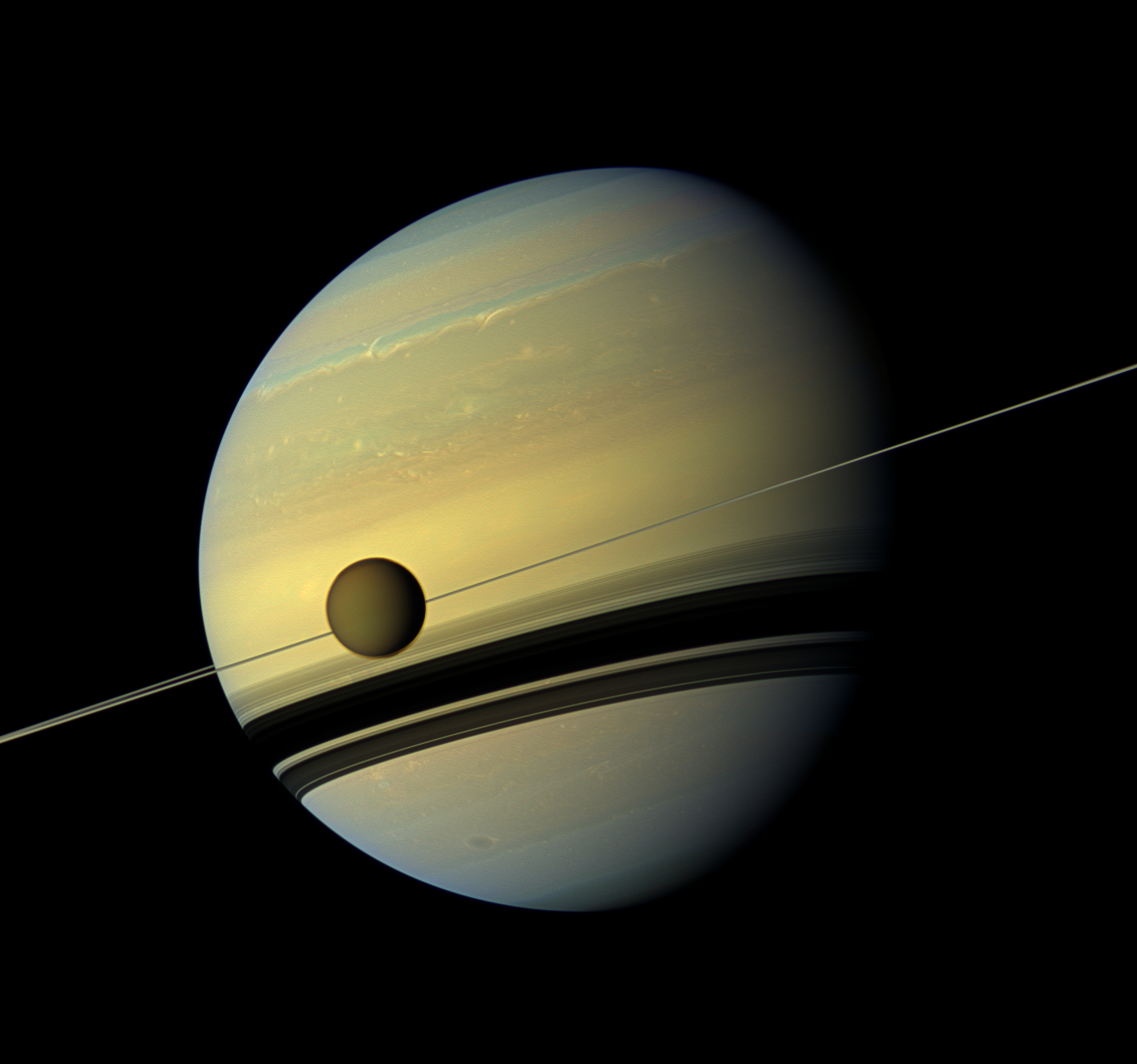 Titan orbiting Saturn