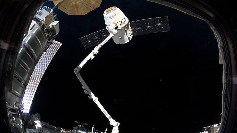 A SpaceX Dragon cargo vehicle is captured by the International Space Station’s Canadarm2 prior to berthing July 27. 
