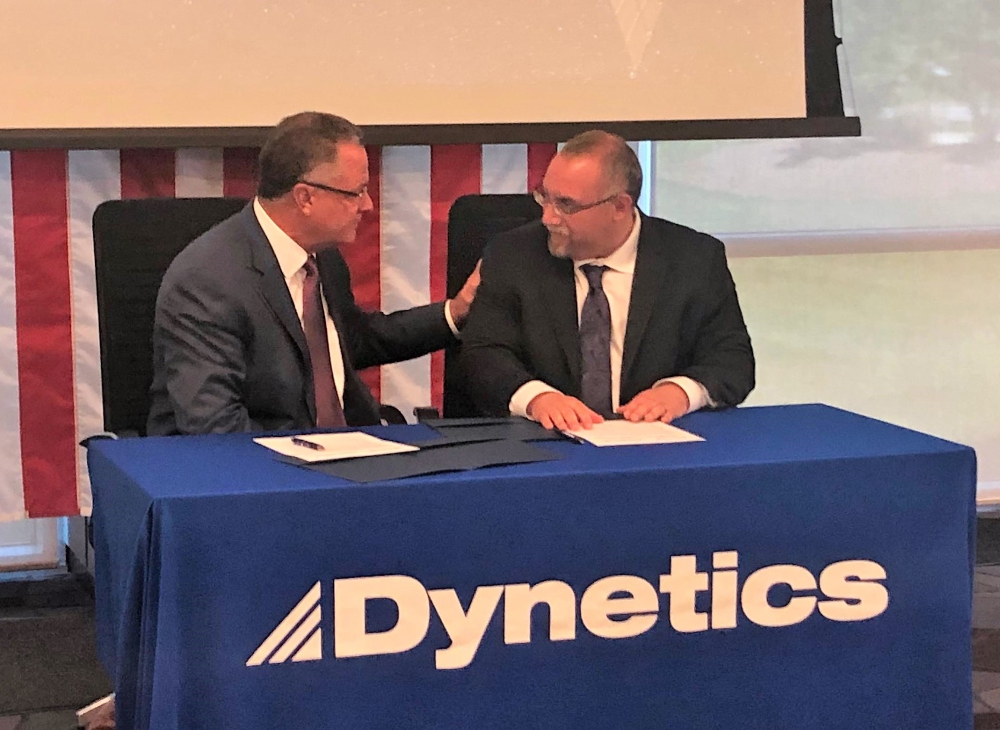 Dave King, left, and Mike Gold during a press conference announcing the signing of a teaming agreement between the companies.