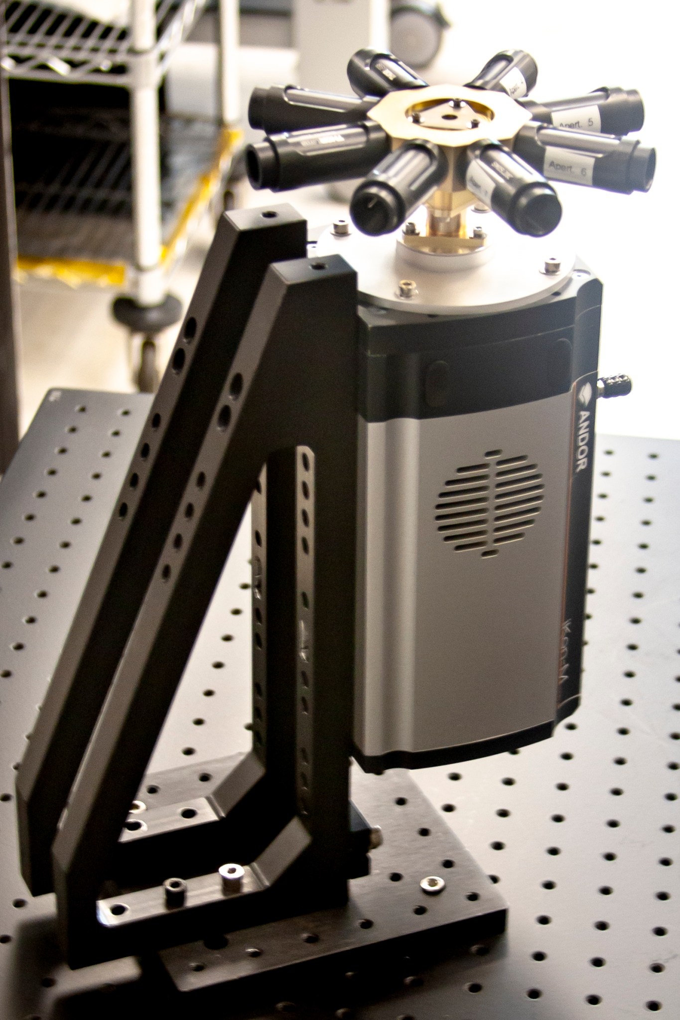 The MASTAR instrument on a table, it's microscope sized and has eight cylinder chambers on the top