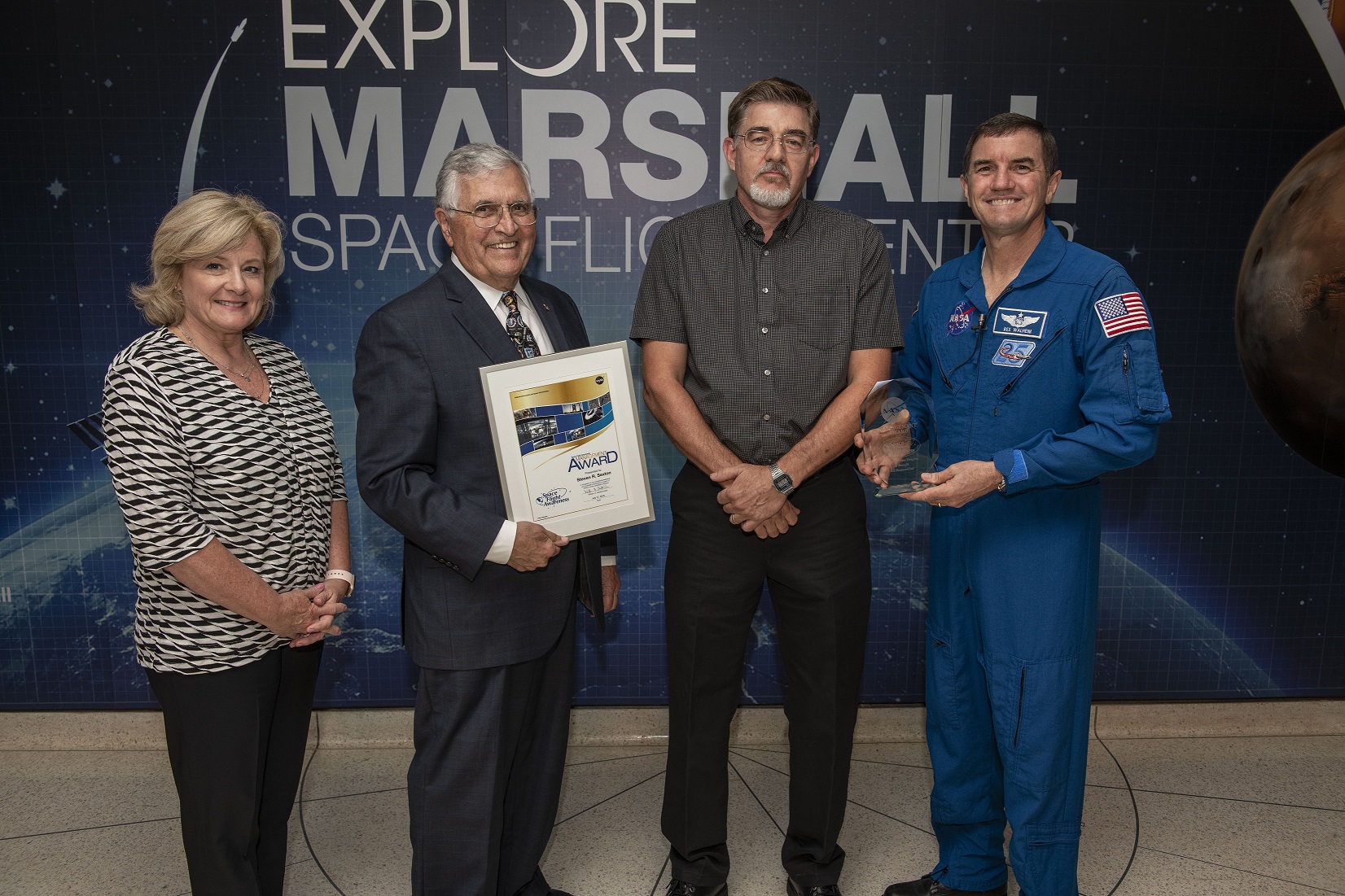 Steven Sexton, third from left, accepts the Management Award at the Space Flight Awareness Awards ceremony July 17.
