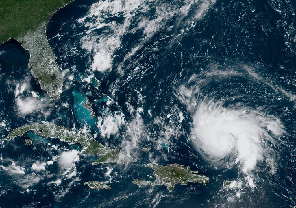 Hurricane Dorian, right, as viewed from the GOES-East satellite on Thursday, Aug. 29, 2019.