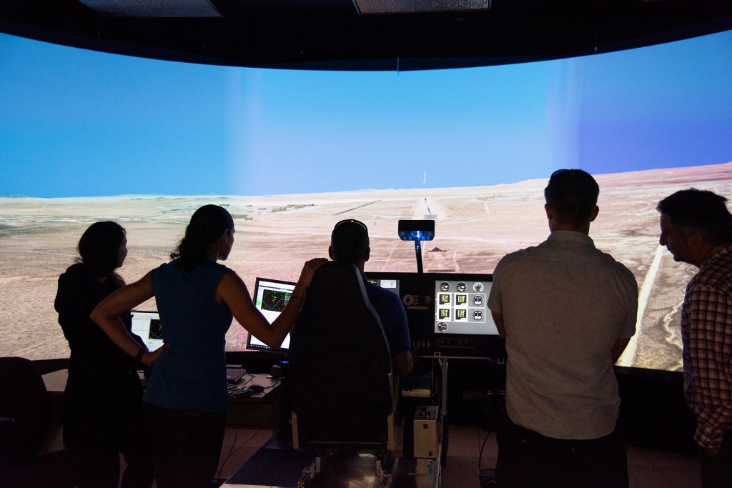 NASA's 2017 astronaut candidates practice flying the X-57 simulator at AFRC.