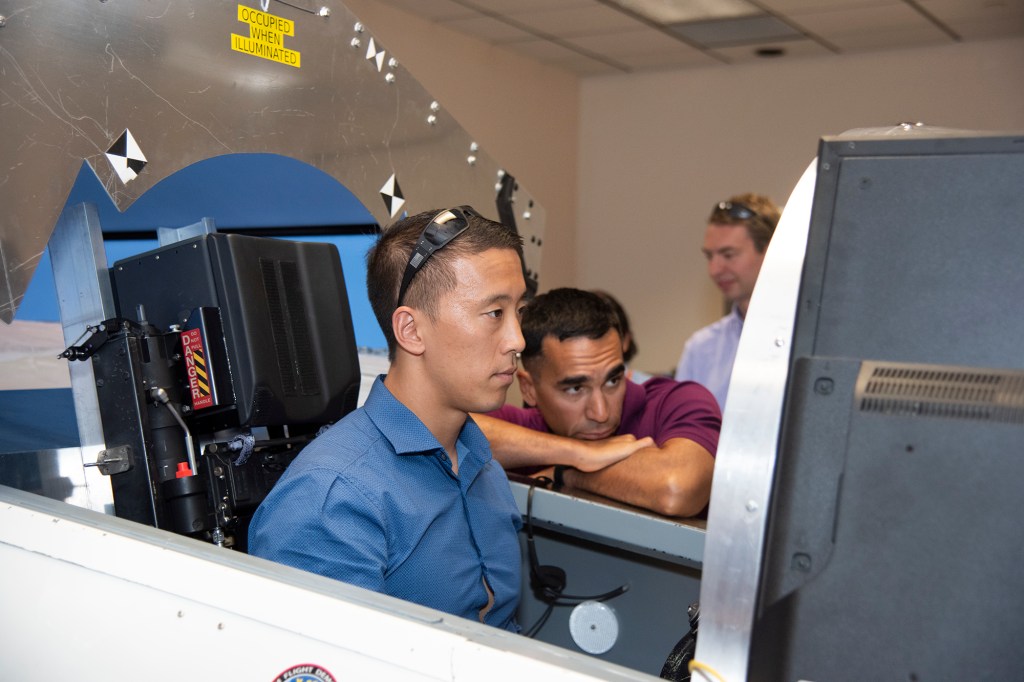 NASA?s 2017 astronaut candidates practice flying in an X-59 QueSST simulator at AFRC.