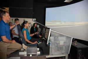 NASA's 2017 astronaut candidates practice flying in X-57 aircraft simulator at AFRC.