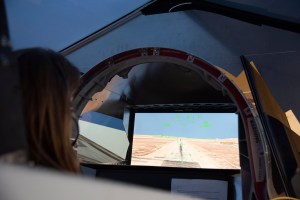NASA's 2017 astronaut candidate Kayla Barron practices flying in an X-59 QueSST simulator at Armstrong Flight Research Center,