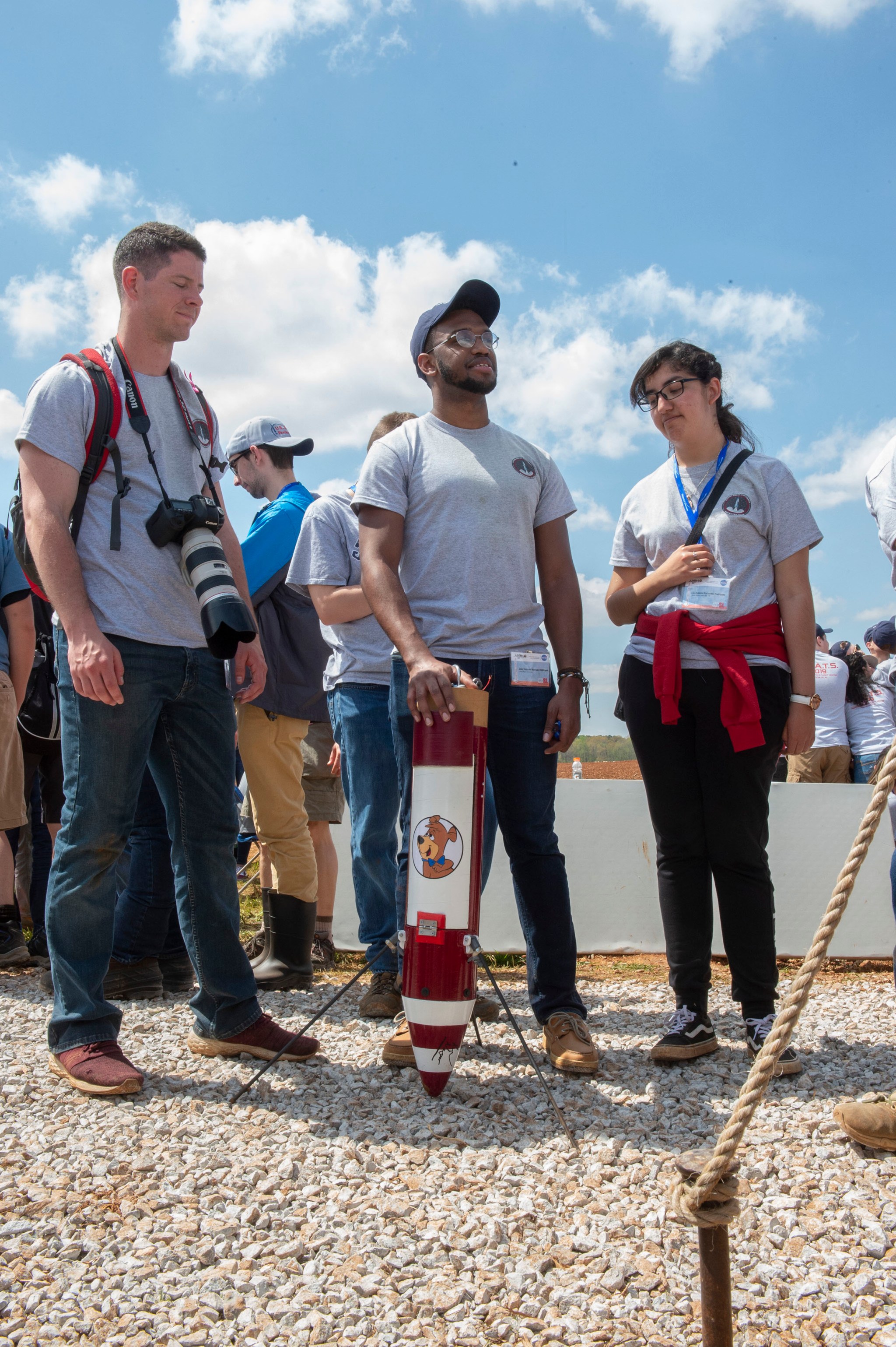 Students standing by model rocket section