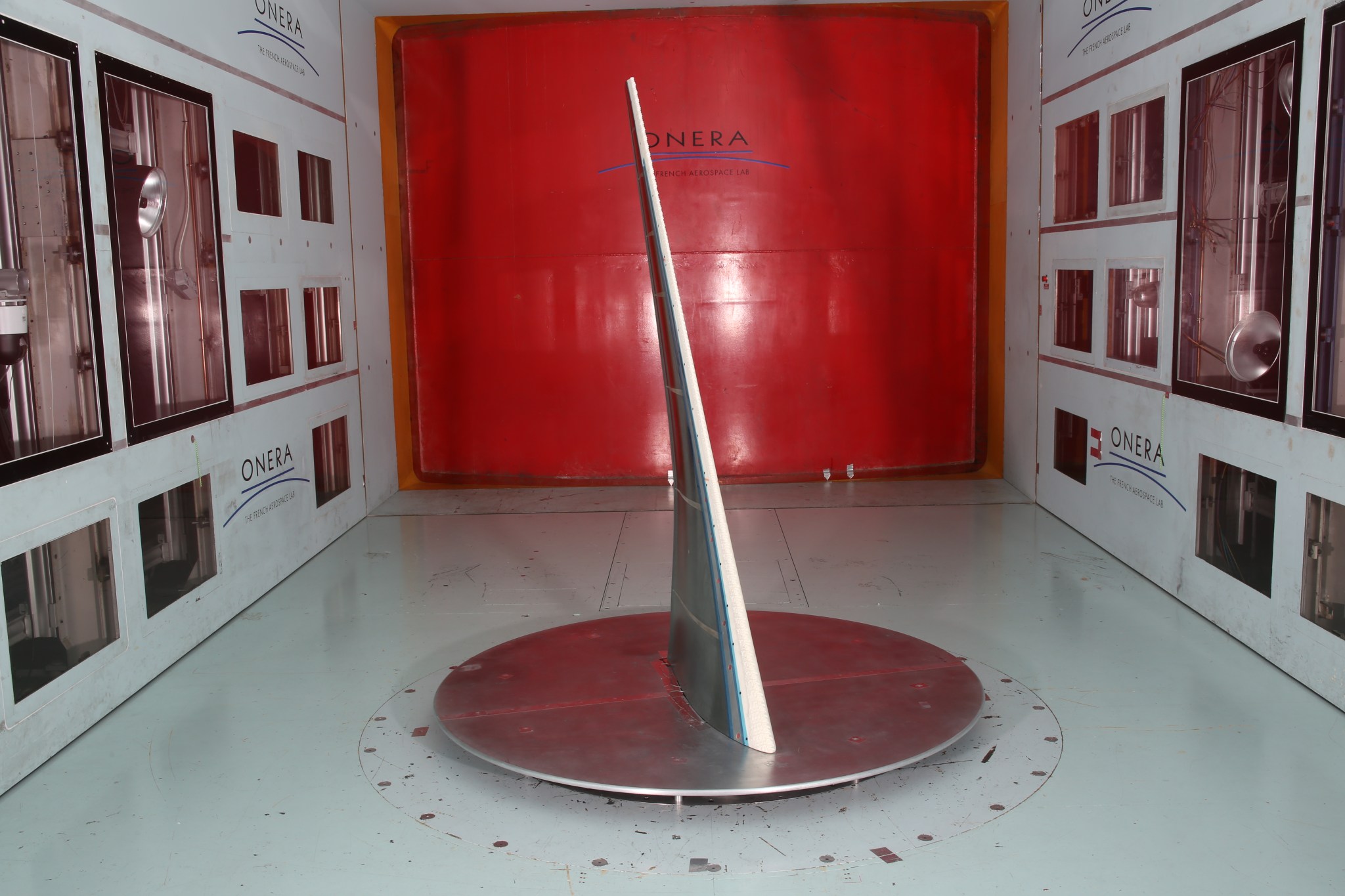 A portion of an aircraft wing being tested in a wind tunnel.
