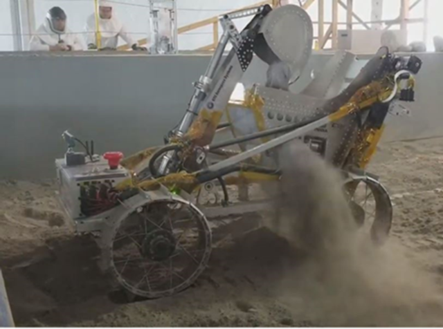 A remote-controlled robot kicks up dirt