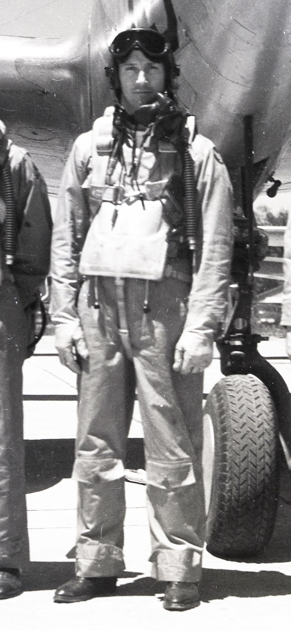 Pilot standing in front of aircraft.