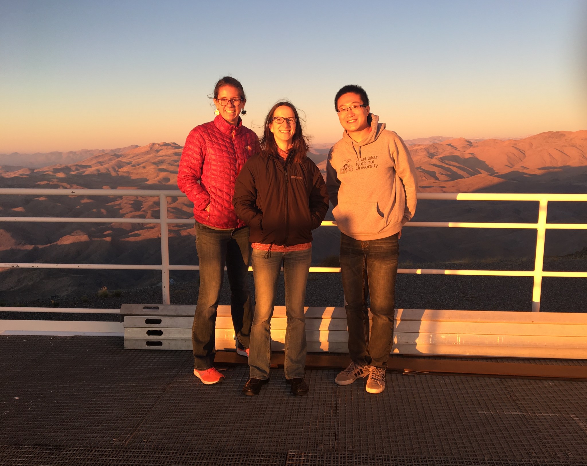 three astronomers at Magellan II telescope in Chile