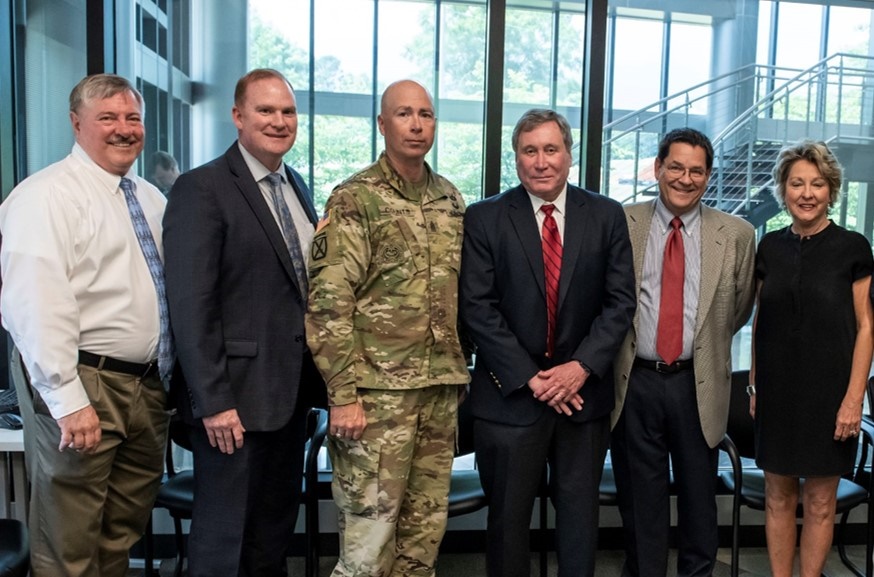 Leaders from NASA, Redstone, the FBI and the TVA meet to sign the Federal Smart City Coordinating Committee on June 18.