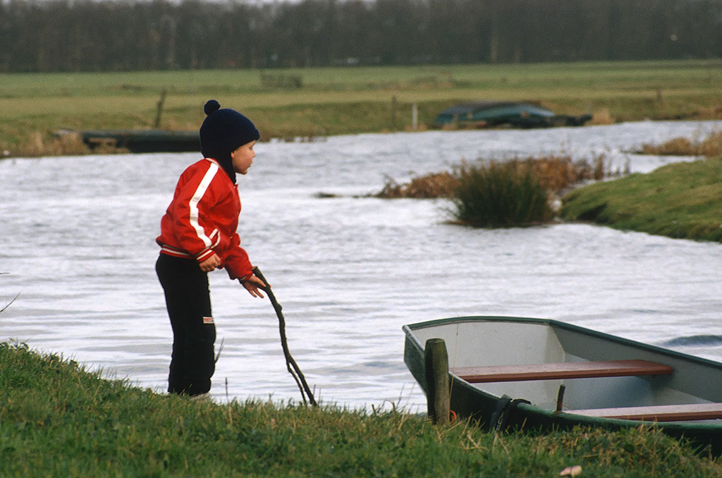 Christiaan as a small boy playing at a canal near Gytsjerk, probably wearing klompen