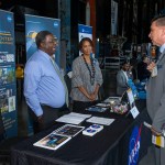Melvin Scruggs, left, and Mary Poe speak with an attendee at the Small Business Alliance Meeting on Sept. 19.