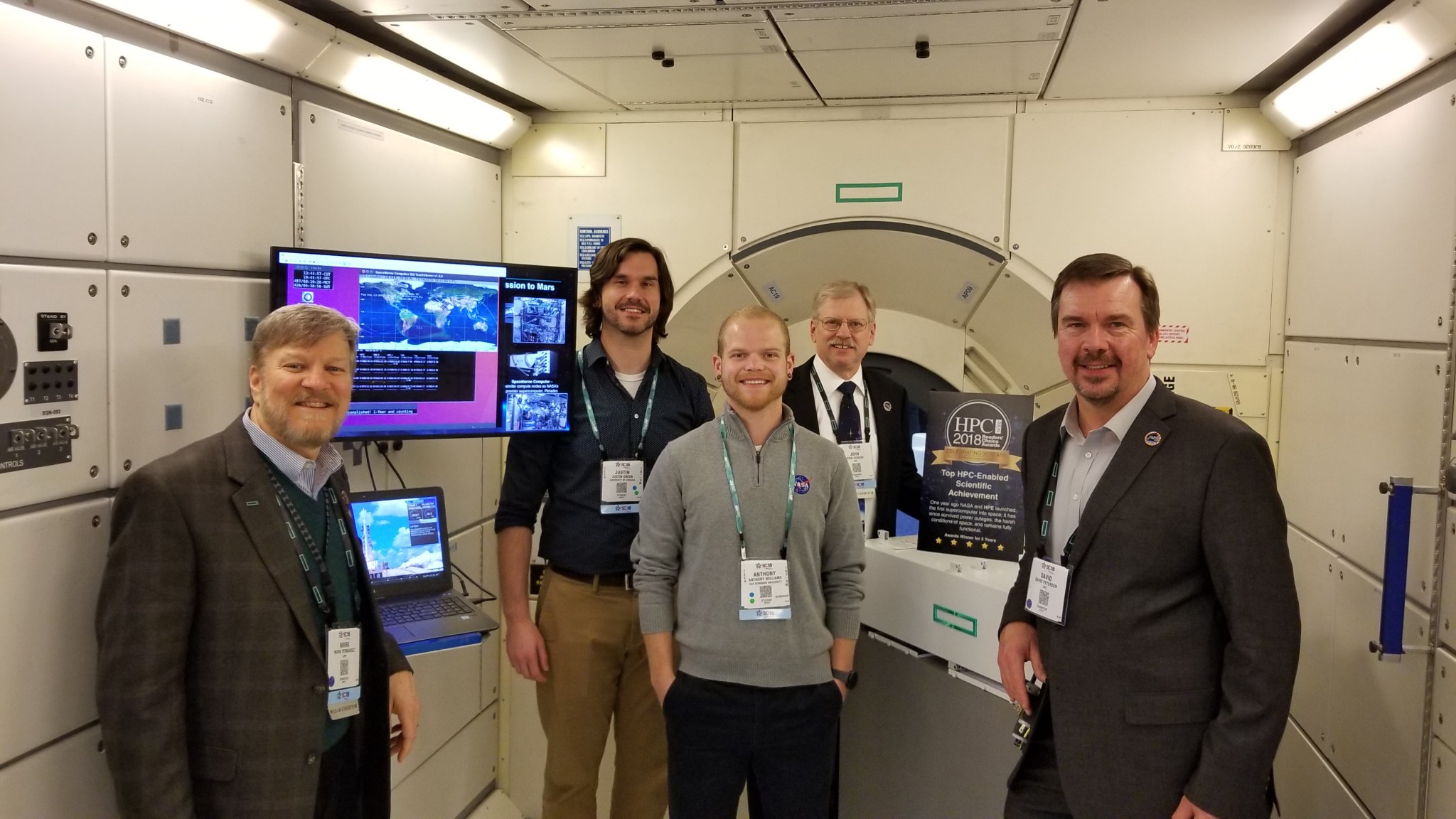 Green and Williams (pictured center and left of center) participated in a panel discussion with HPE at the Supercomputing 2018 c