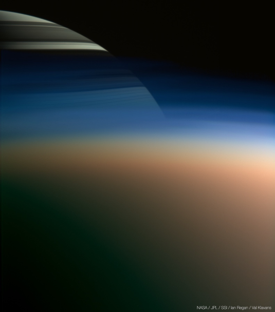 Saturn peeking through Titan's thick atmosphere. Composite made of images taken by the ISS in 2005. Cassini was approximately 1,