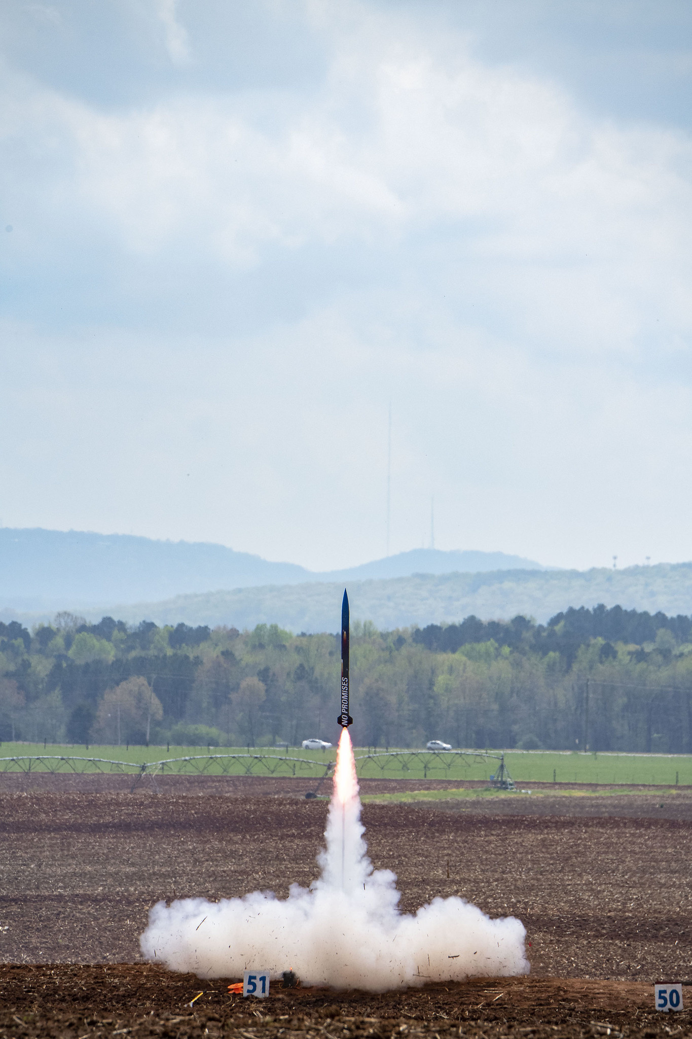 The rocket named No Promises from North Carolina State University in the 2019 competition roars off the launch pad.