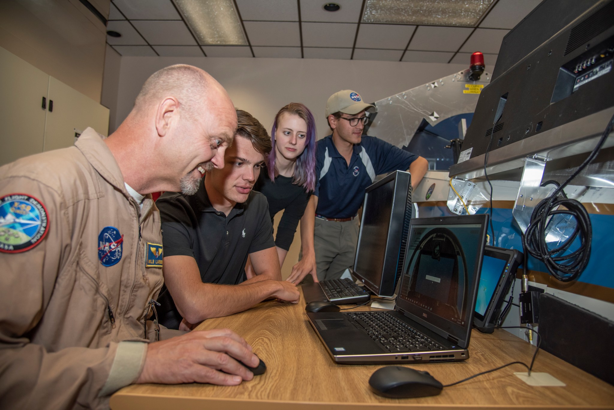 Nils Larson demoing the X-59 flight simulator to students.