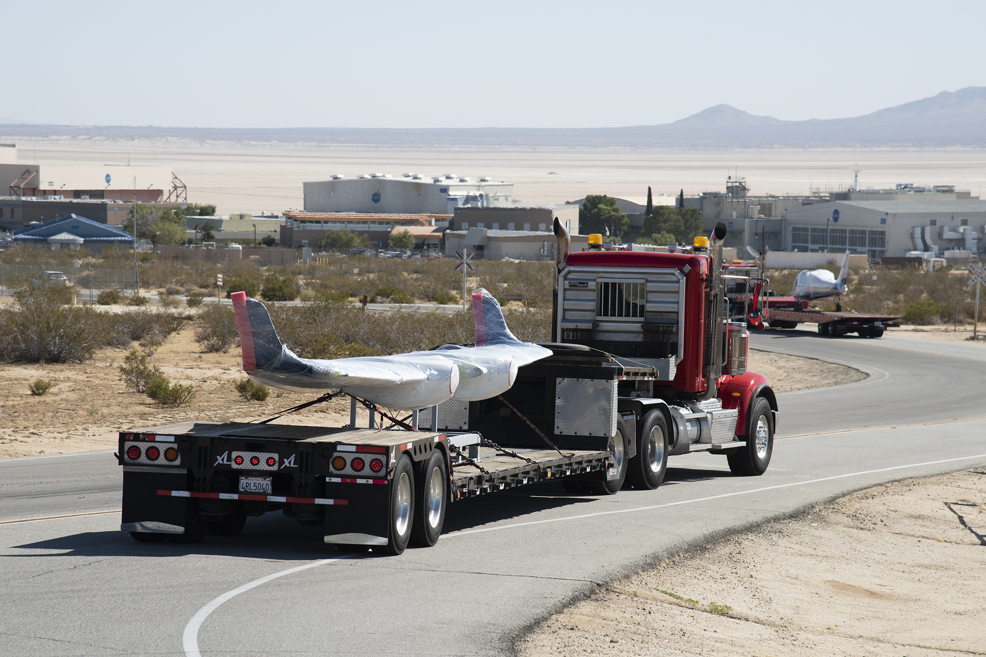 NASA?s all-electric X-57 Maxwell, in its Mod II configuration, arrives at AFRC.
