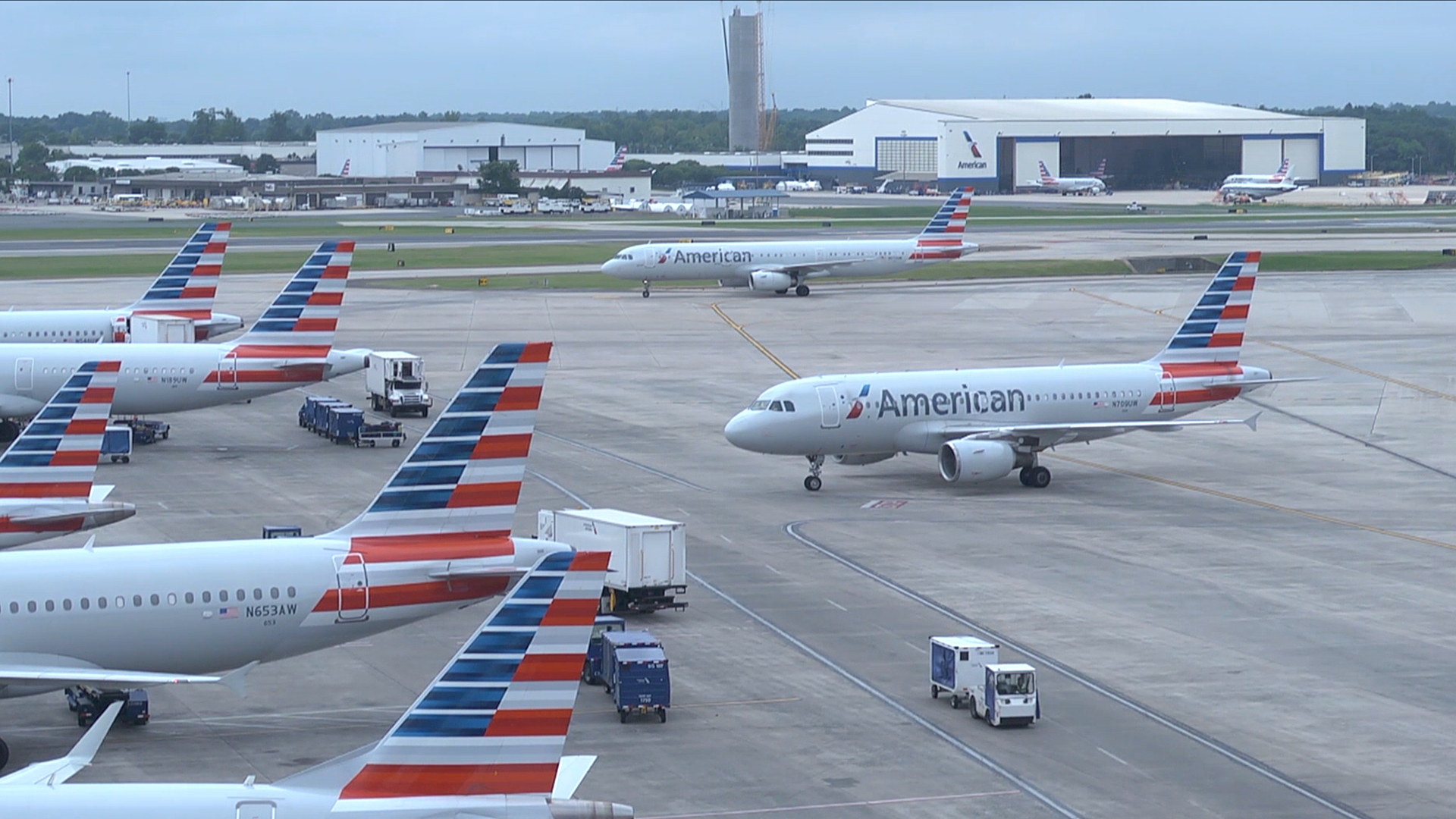 Airplanes at the airport terminal parked on the tarmac.