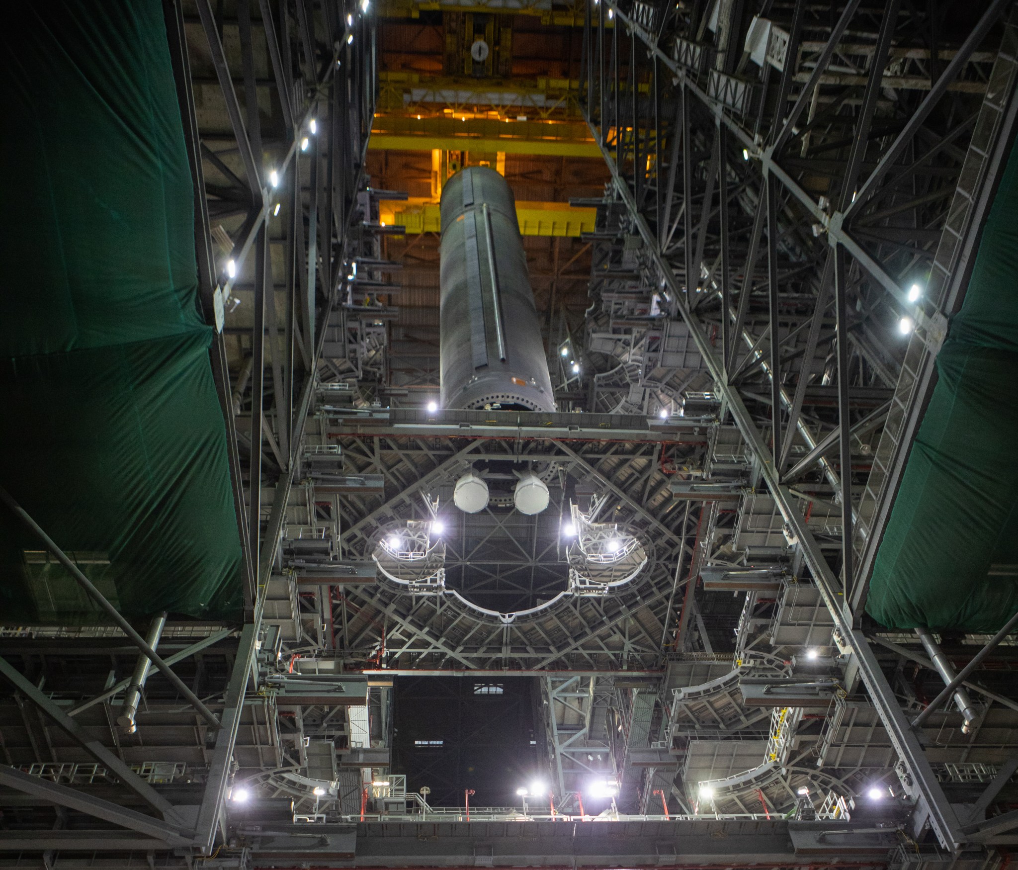 The SLS core stage pathfinder is lowered into High Bay 3 in the Vehicle Assembly Building at NASA's Kennedy Space Center.