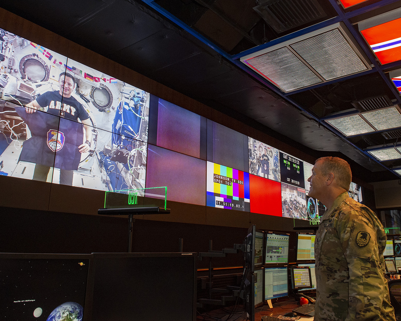 Army Lt. Gen. James Dickinson, right, speaks with NASA astronaut Andrew Morgan.