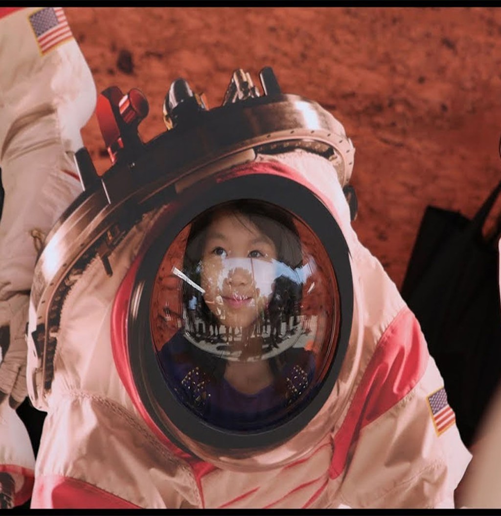 Little girl in spacesuit