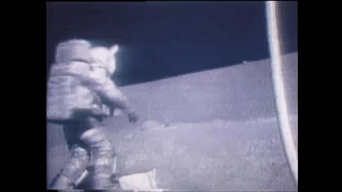 Astronaut Harrison Schmidt stumbles while picking something up on the Moon.