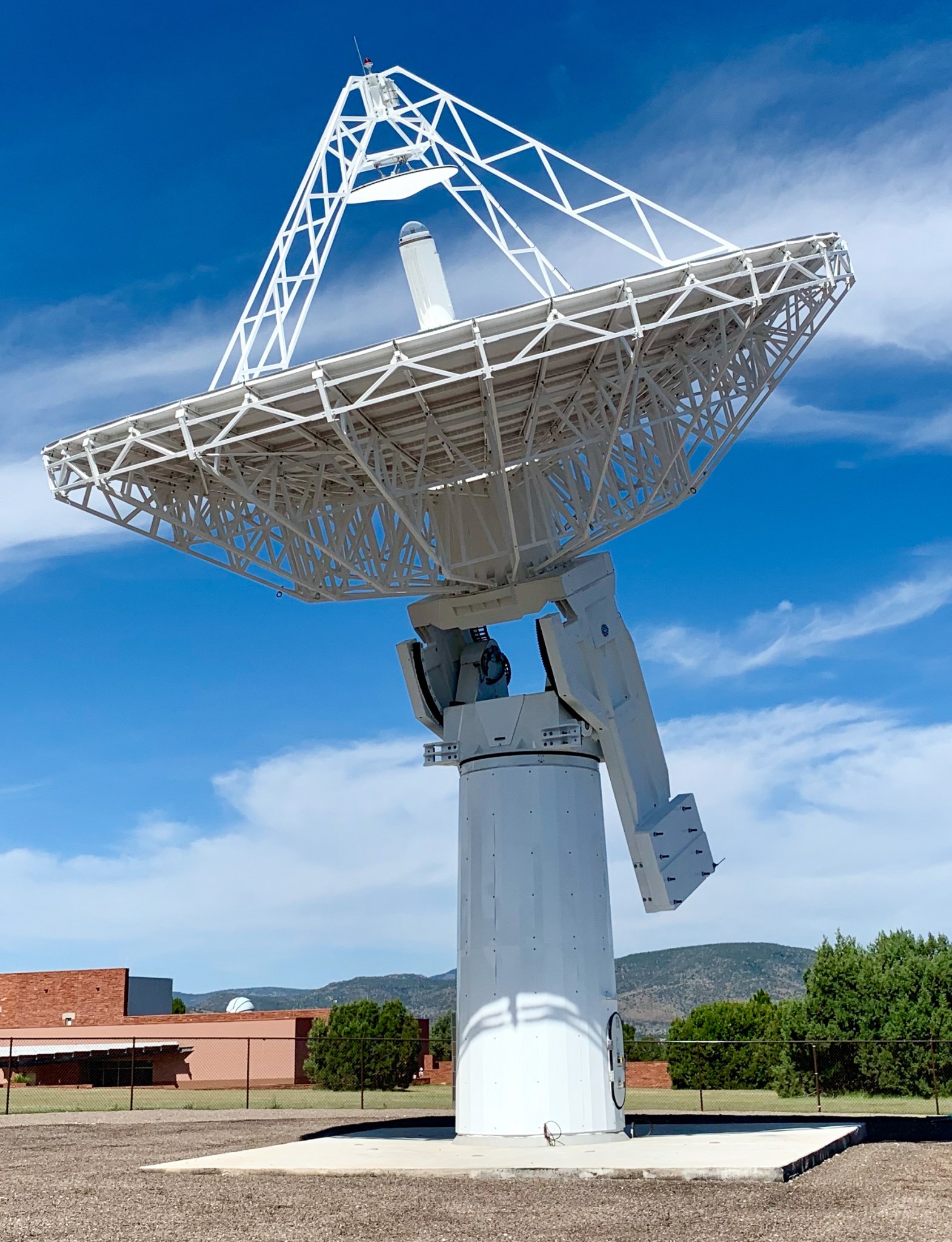 A satellite dish pointed up at the sky.