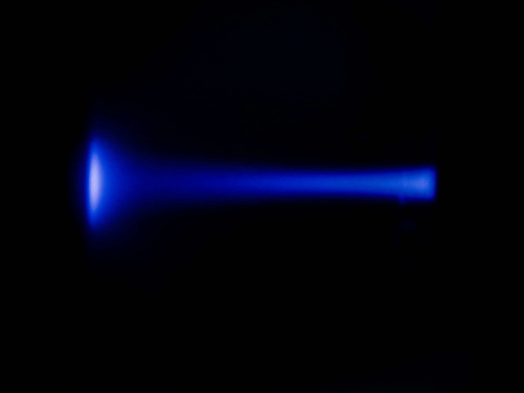 A black background with a blue line across the center. The line is largest on the left. 