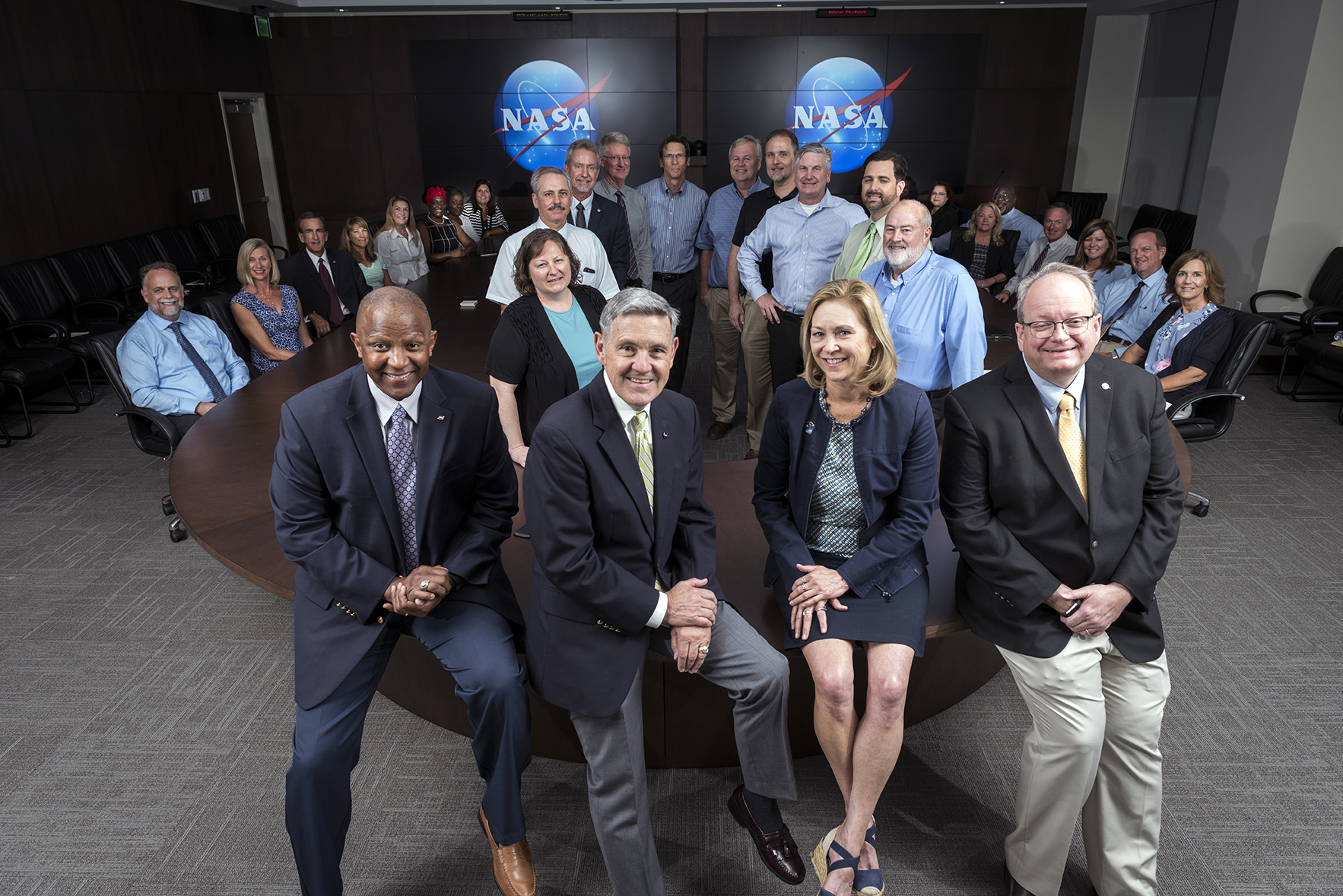 Kelvin Manning, Bob Cabana, Janet Petro and Burt Summerfield are photographed in front of Kennedy Space Center senior executives