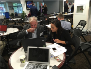 Anh Nguyen (ARC) and Tony Freeman (JPL) discuss the next steps in an orbital dynamics study for scientific synergy between the u