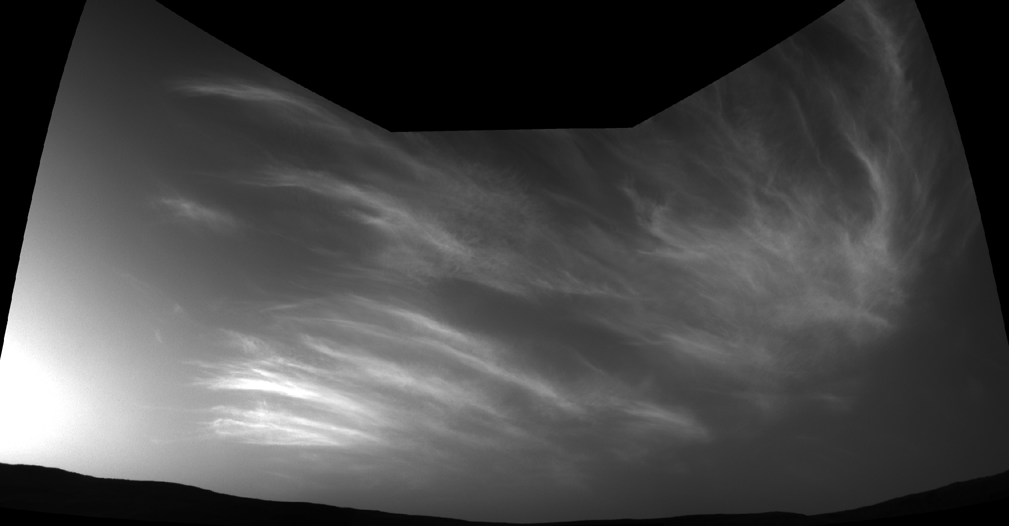 Clouds drifting over Martian landscape.