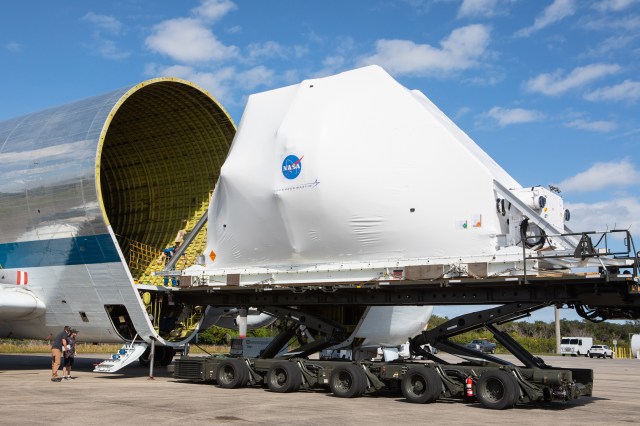NASA?s Orion spacecraft, wrapped up for shipping, is carefully aligned for loading into the agency?s Super Guppy aircraft.