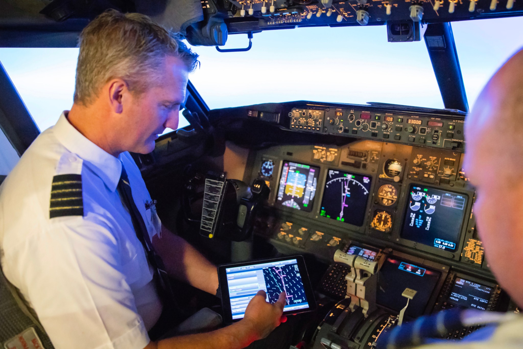 Alaska Airlines pilot Bret Peyton tests NASA's Traffic Aware Planner software on the flight deck