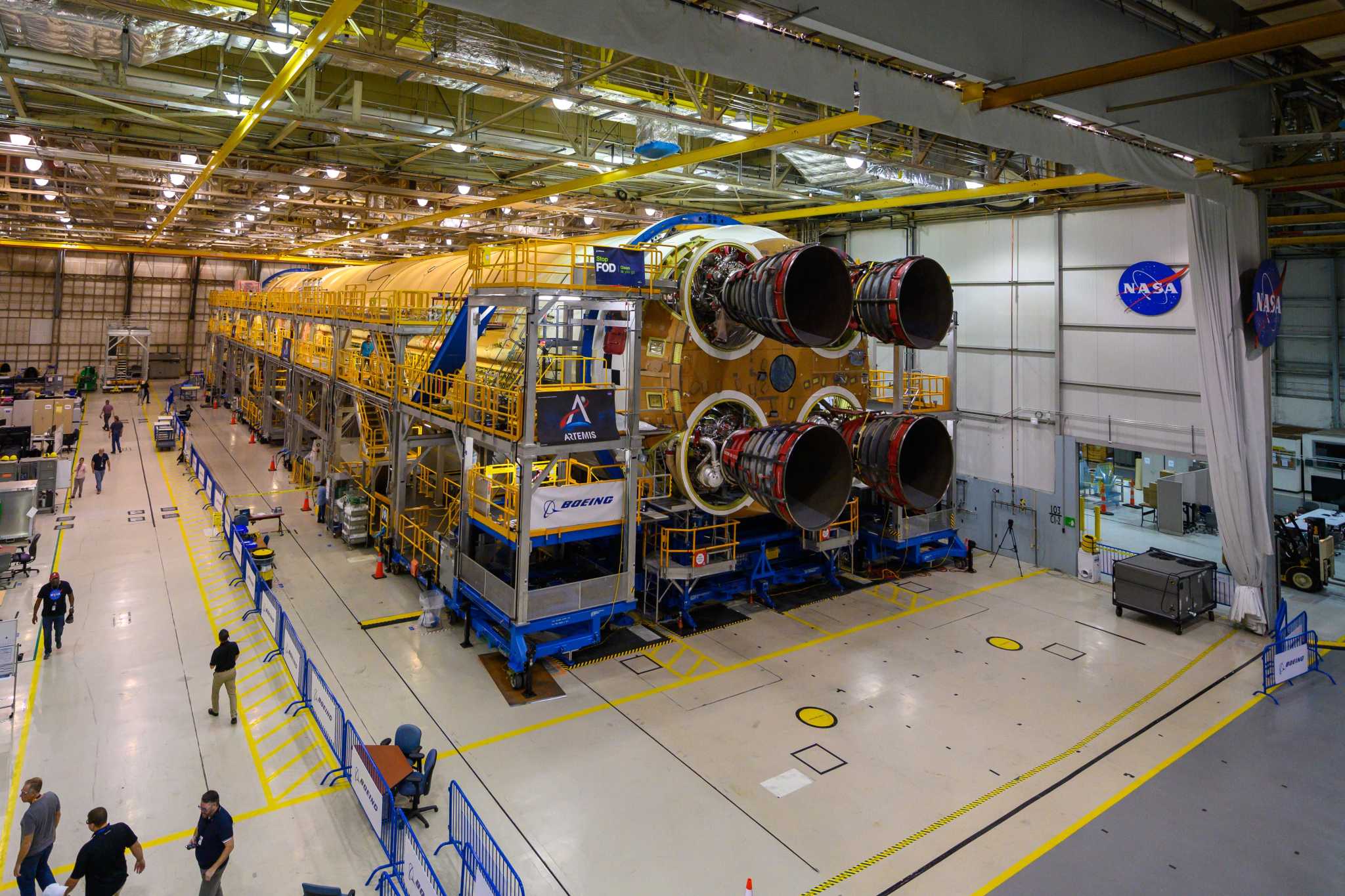 Engineers and technicians attached the last of four RS-25 engines that will provide the necessary thrust for the SLS rocket