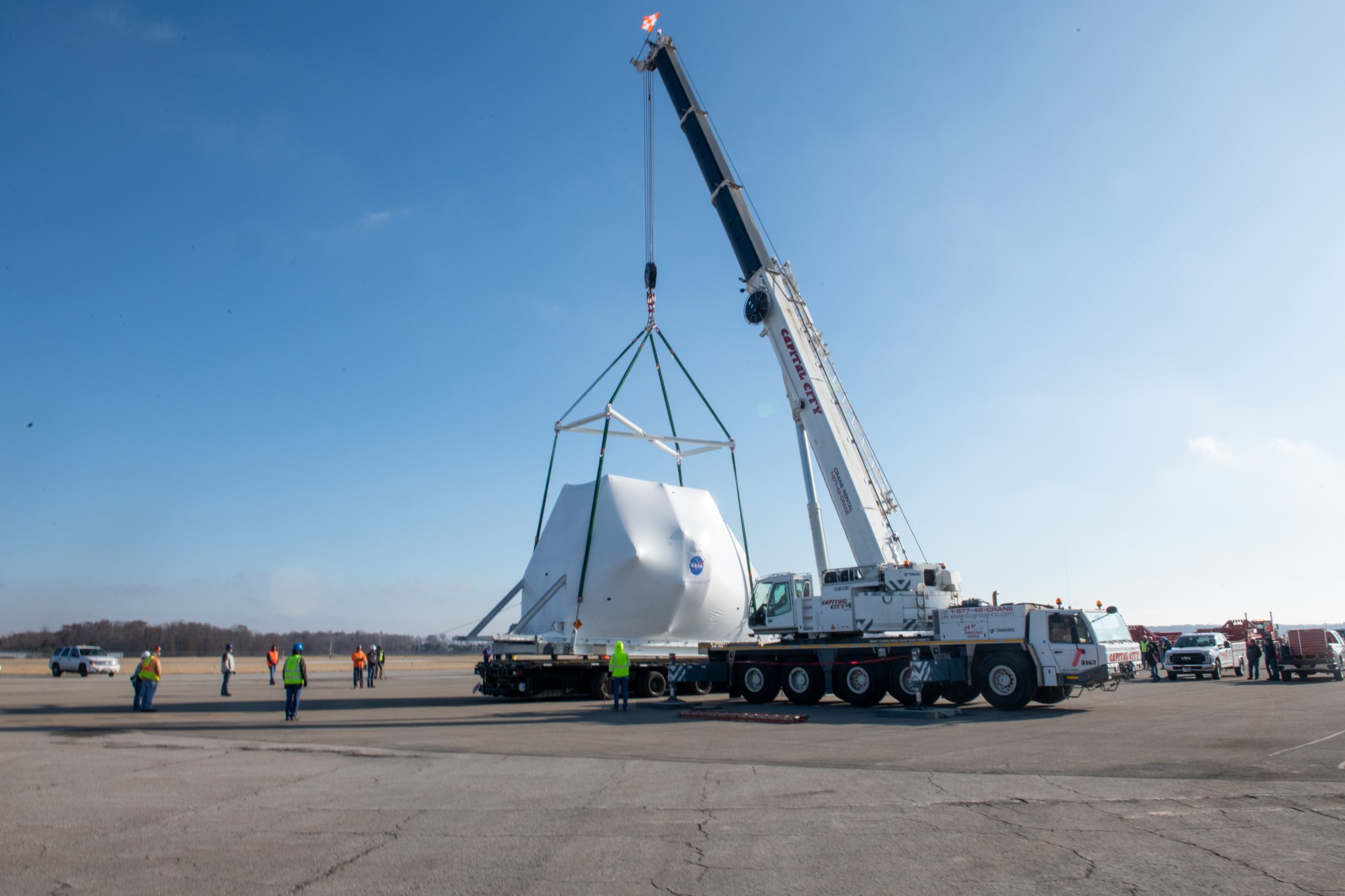 The Orion Spacecraft being lifted onto the truck for transport.