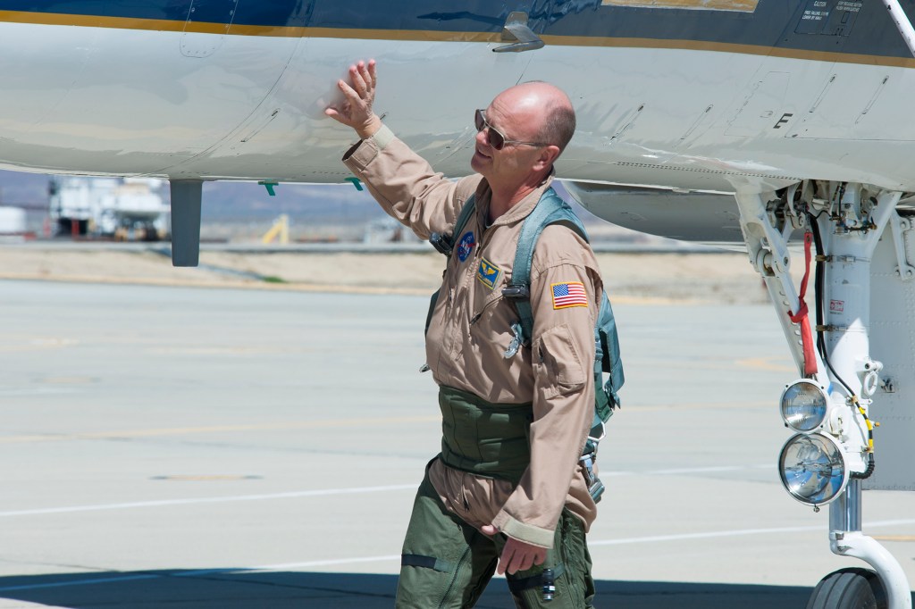 NASA pilot Nils Larson checks out the NASA F-15B aircraft before he climbs into the cockpit.