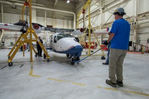 The X-57 fuselage is positioned under the Mod II wing section so that it can be reattached.