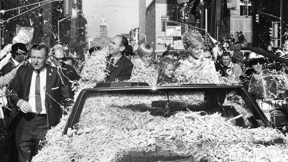 Alan Bean and his family are covered in ticker tape in their convertable during a Parade in Ft. Worth