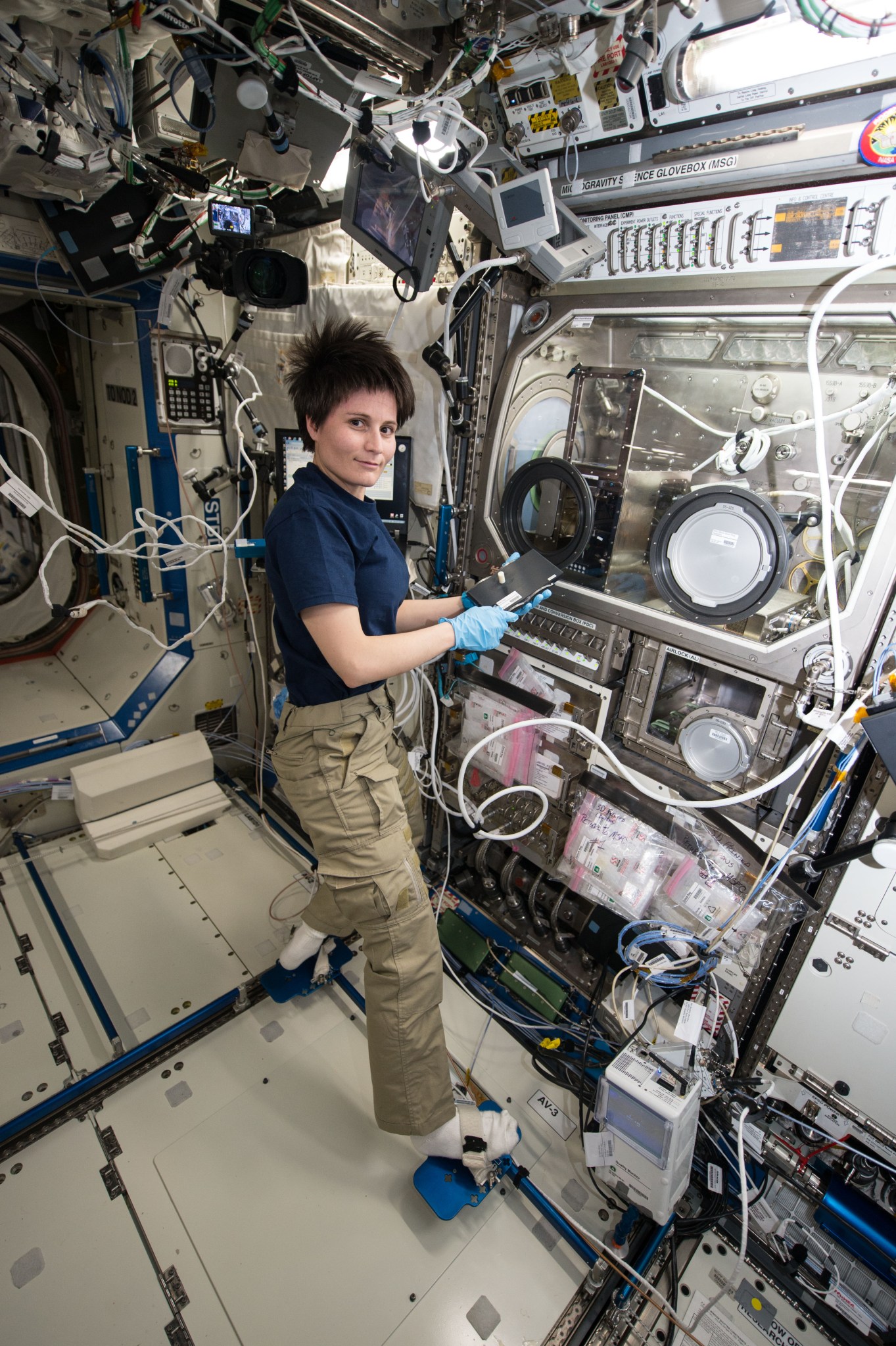 astronaut Samantha Cristoforetti working inside the space station