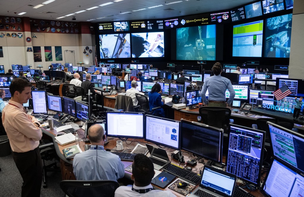 Overall view of flight controllers on console