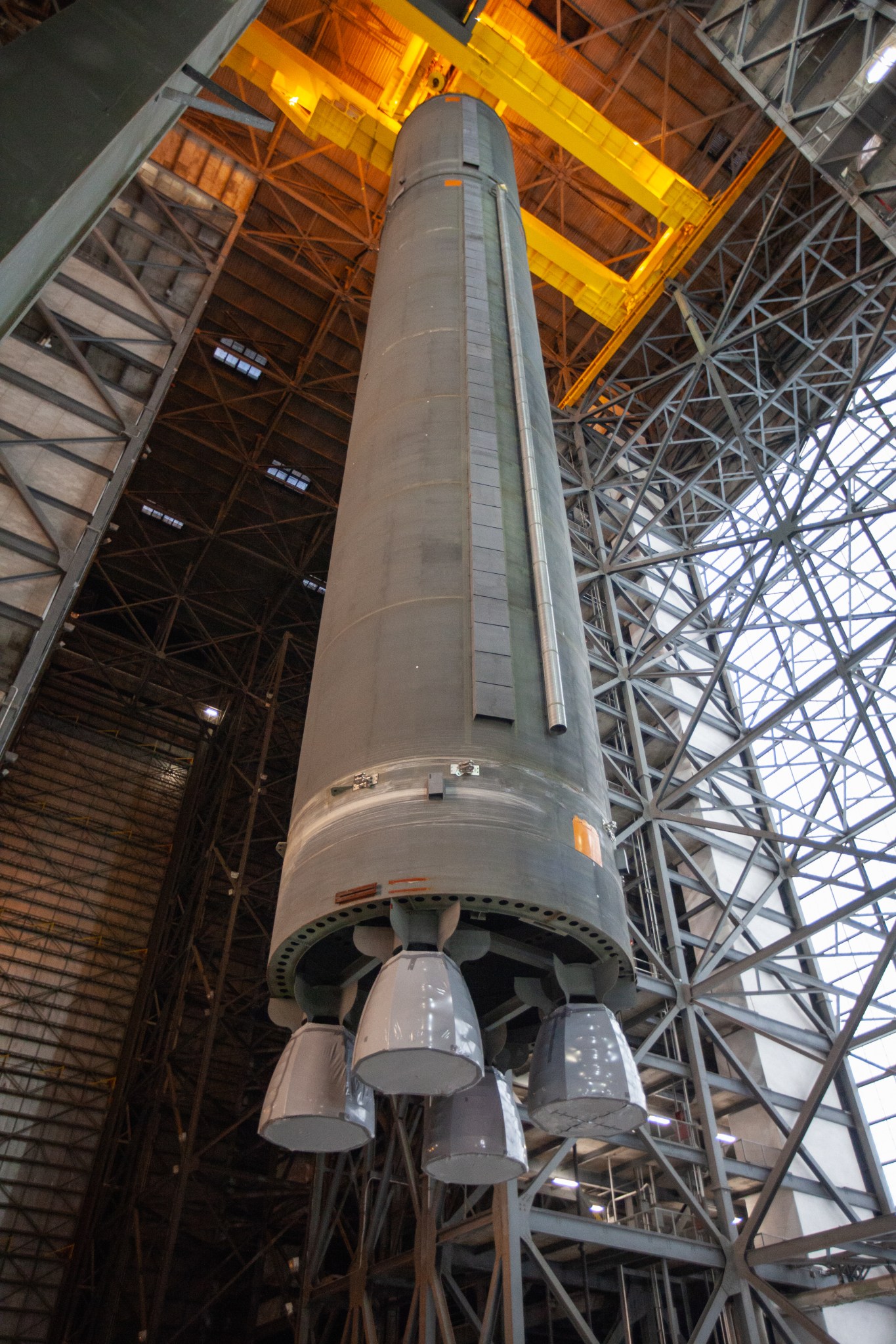 Inside the VAB at the Kennedy Space Center, a crane lifts the Space Launch System Core Stage pathfinder on Oct. 16, 2019.